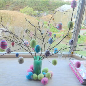 branches with colorful eastereggs hanging on it