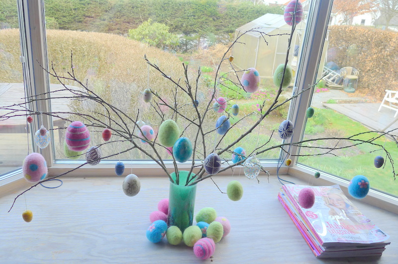 branches with colorful eastereggs hanging on it