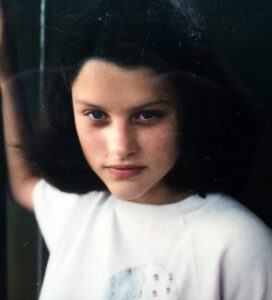 Joanna as a teen on balcony in Switzerland