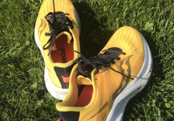 yellow running shoes on grass
